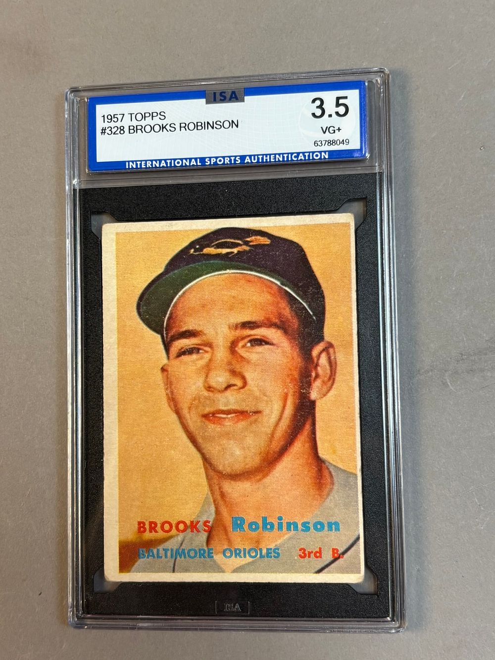 Lot 221G: 1957 Topps #328 Brooks Robinson RC HOF ISA 3.5 VG+ Very Good