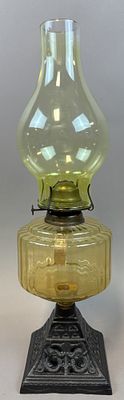 Uranium Vaseline Glass Oil Lamp w/ Cast Iron Ornate Base 19.5". Late 19th to early 20th century 