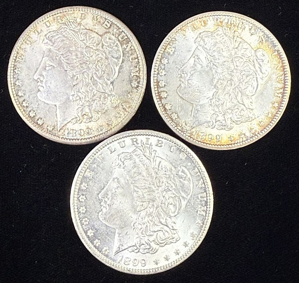 Three Morgan Silver Dollars 1898 1899 1899 Circulated Lot. Lot of three United States Morgan 