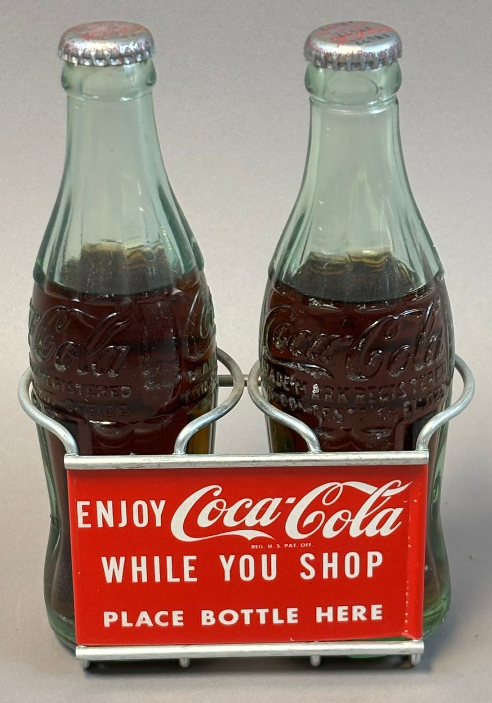 Lot 163: Enjoy Coca Cola While You Shop Tin Litho Shopping Cart Bottle Carrier