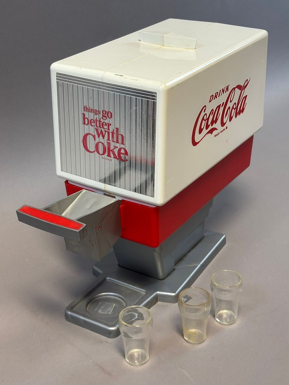 Lot 197: Plastic 1960s Things Go Better With Coke Toy Syrup Dispenser w/ Cups
