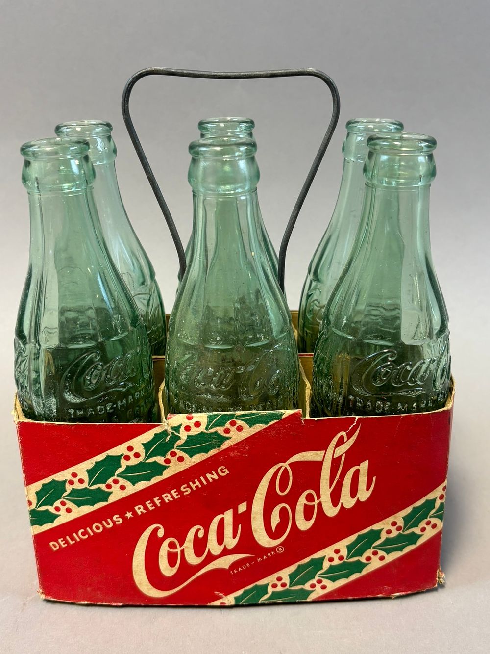 Lot 199: Coca Cola Original 6 Pack Cardboard Christmas Themed Carrier w/ Bottles