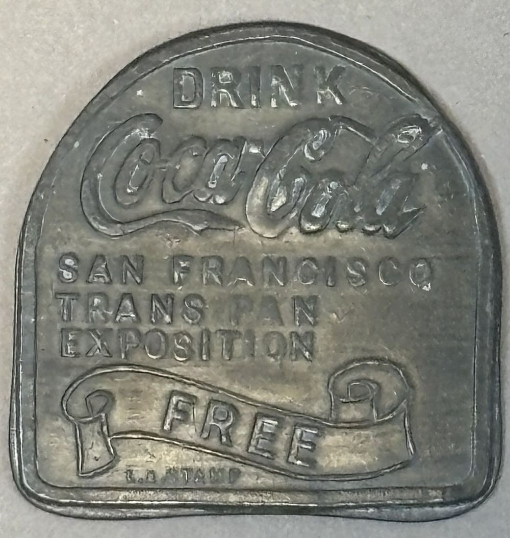 Lot 304: Drink Coca Cola San Francisco Trans Pan Exposition Free Brass Token