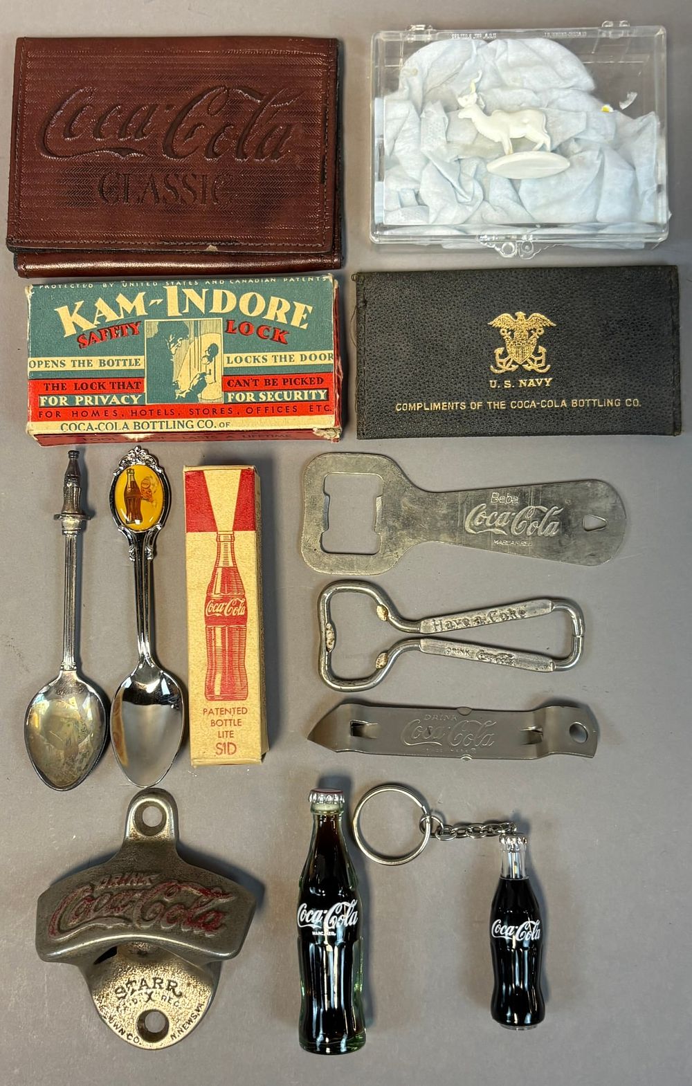 Lot 310: Lot 13 Coca Cola Bottle Openers Keychains Souvenir Spoons Safety Lock & More