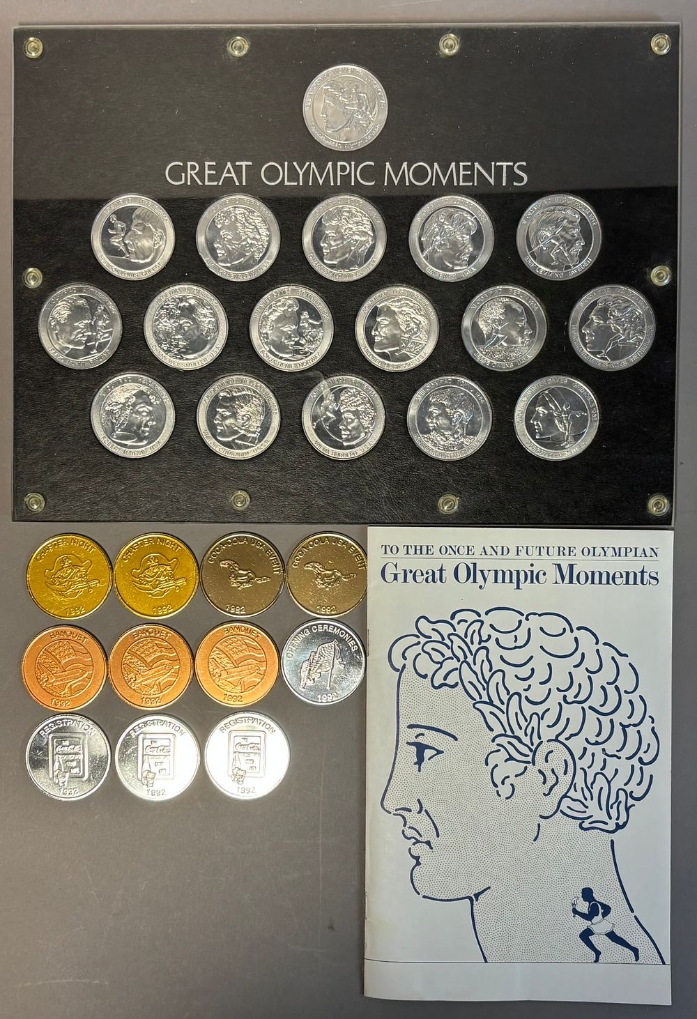 Lot 347: Lot 13 Original Coca Cola Olympian Olympic Moments Book & Advertising Coins
