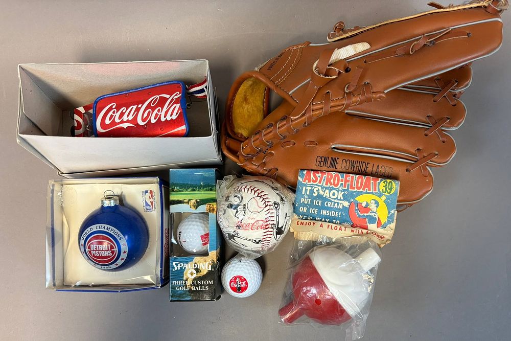 Lot 438: 7 Piece Lot Coca Cola Advertising Items Baseball Glove Toy Pistons Ornament