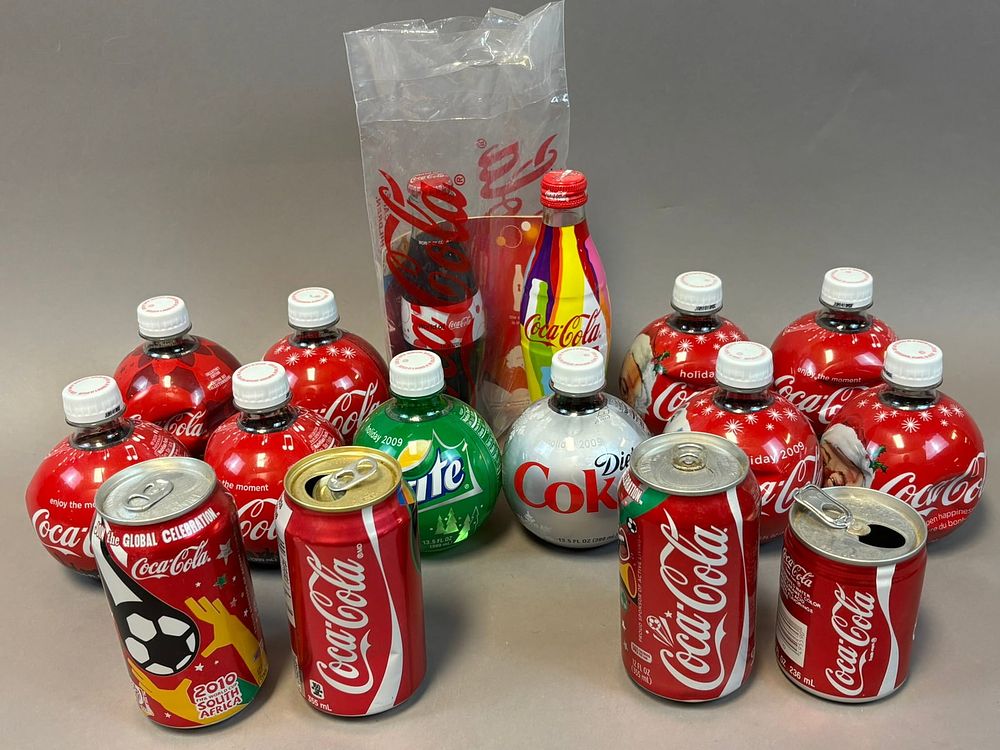 Lot 443: 16 Piece Lot Original Coca Cola Advertising Bottles & Cans Global Celebration