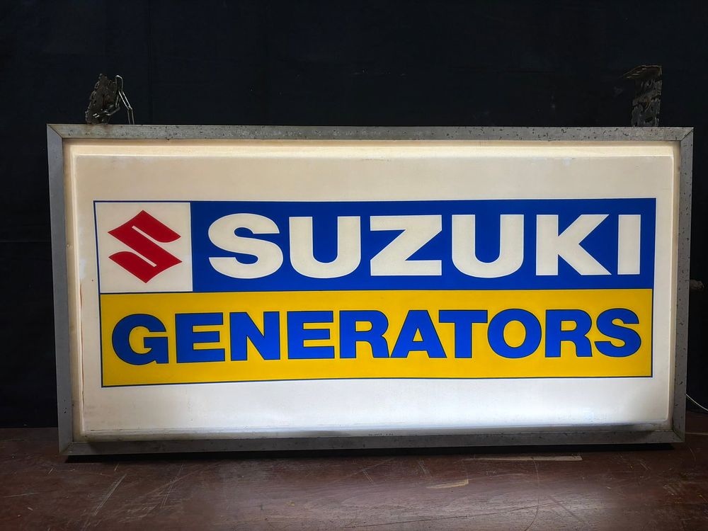 Lot 194: Suzuki Generators Original Plastic 4' Wide Dealership Advertising Store Sign