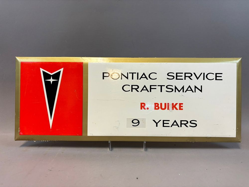Lot 223: Pontiac Service Craftsman R Buike 9 Years Original SST Tin Over Cardboard Sign
