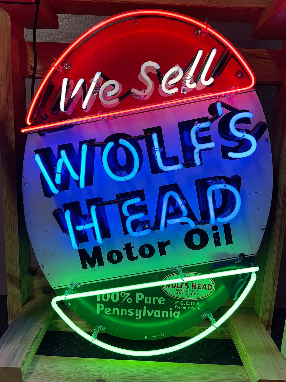 Lot 240: We Sell Wolf's Head Motor Oil SST Tin 1960 Neon Advertising Sign