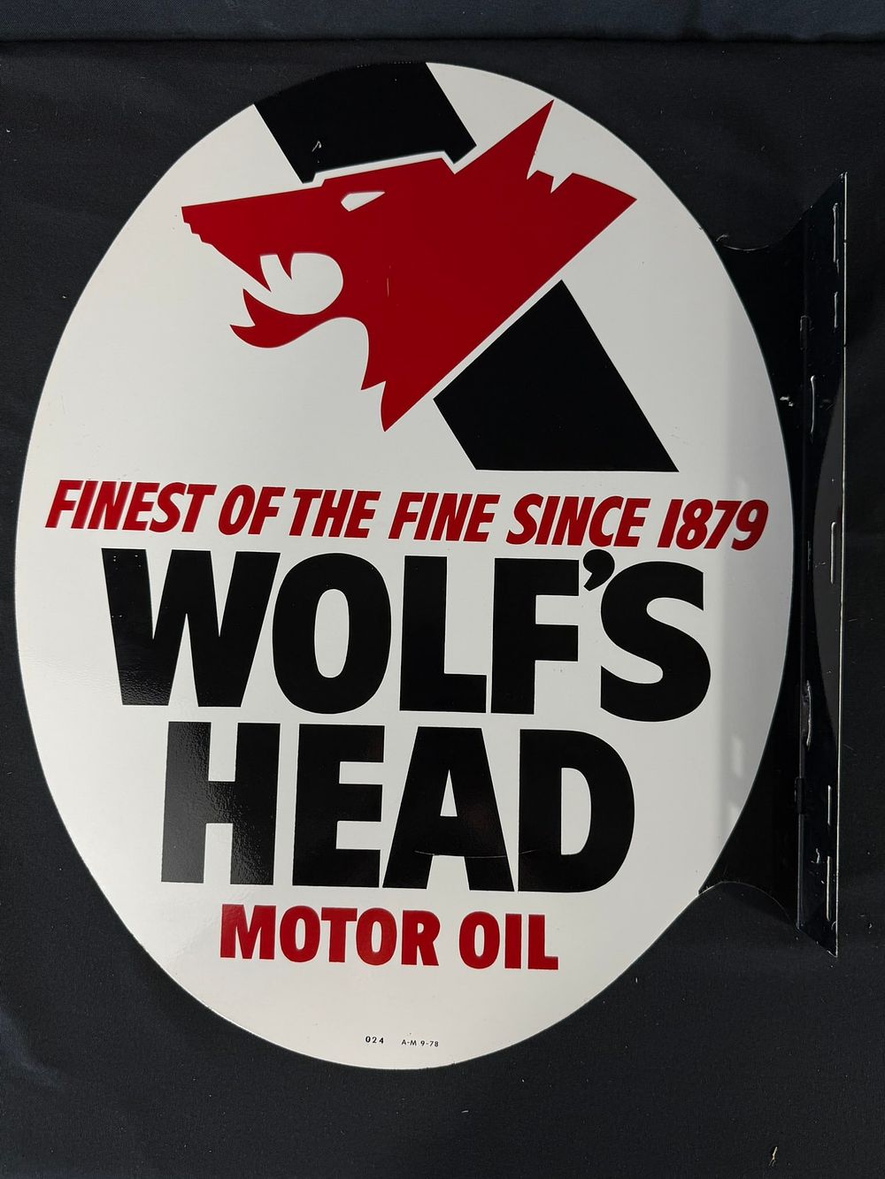 Lot 292: 1978 Wolf's Head Motor Oil DST Painted Metal Flange Sign