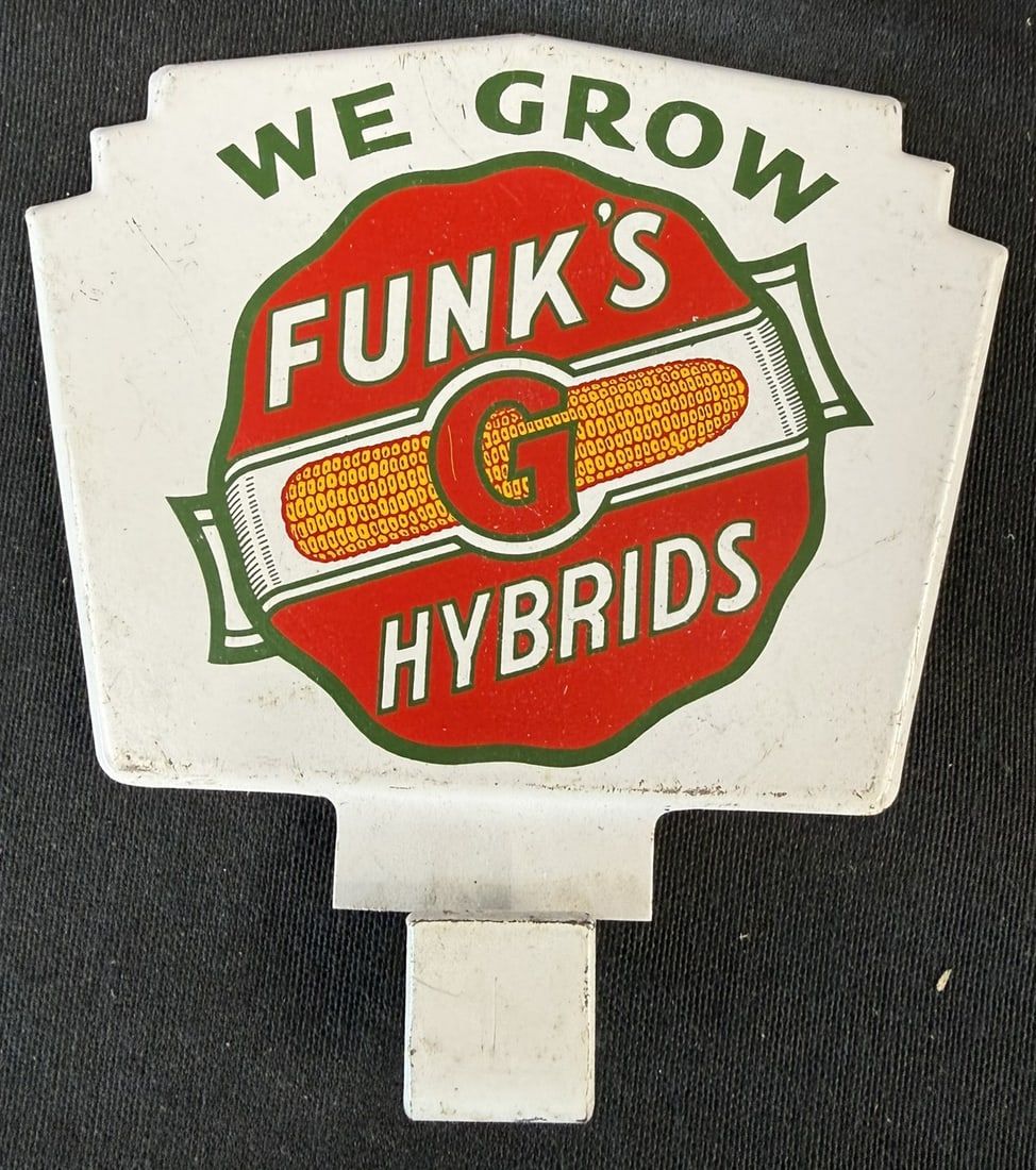 Lot 312: Funk's We Grow Hybrids SST Tin Metal License Plate Topper