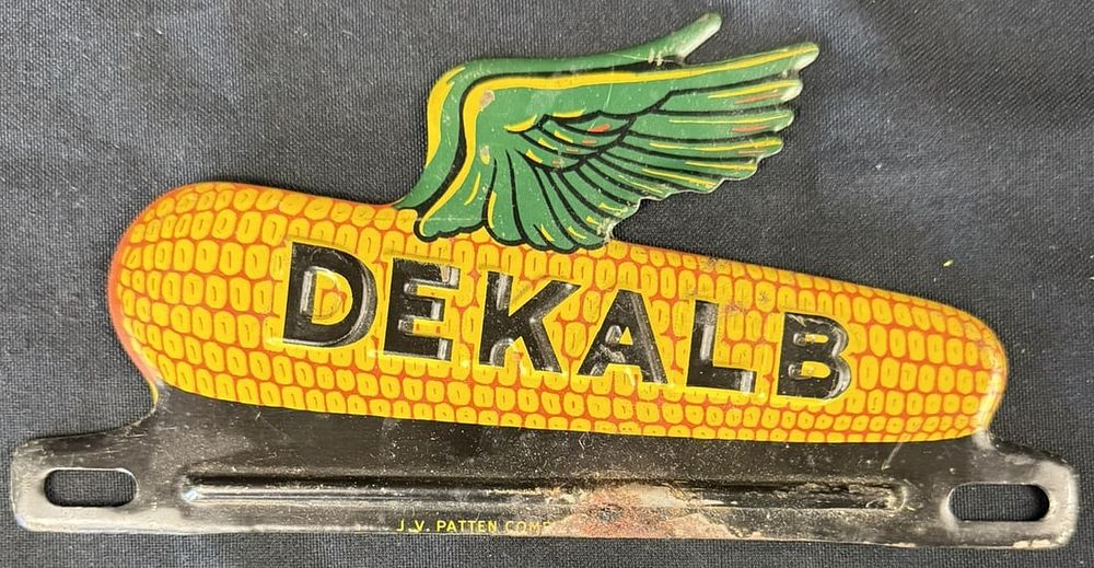Lot 314: Dekalb Embossed Tin Metal Corn Graphics License Plate Topper