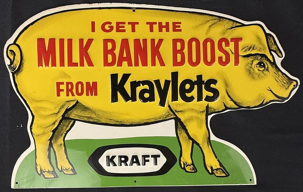Lot 325: Milk Bank Boost Kraylets Kraft Diecut SST Tin Metal Pig Sign