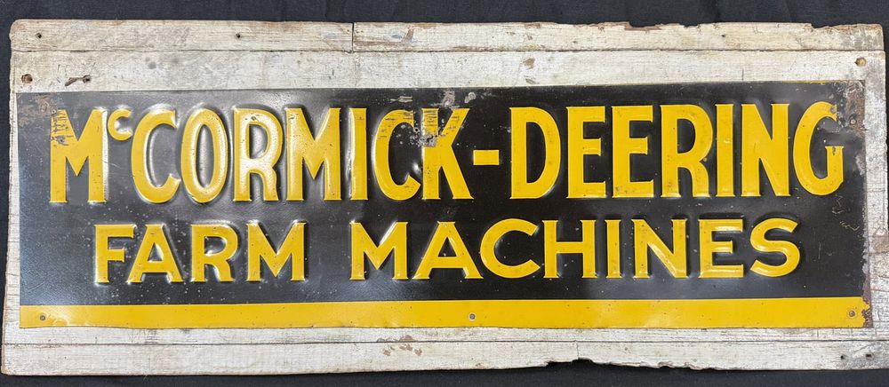 Lot 344: McCormick Deering Farm Machines Embossed Metal Tractor Sign