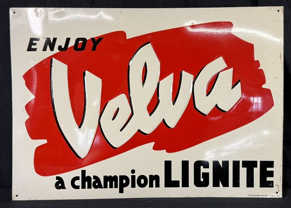 Lot 359: Velva A Champion Lignite SST Painted Metal Embossed Sign