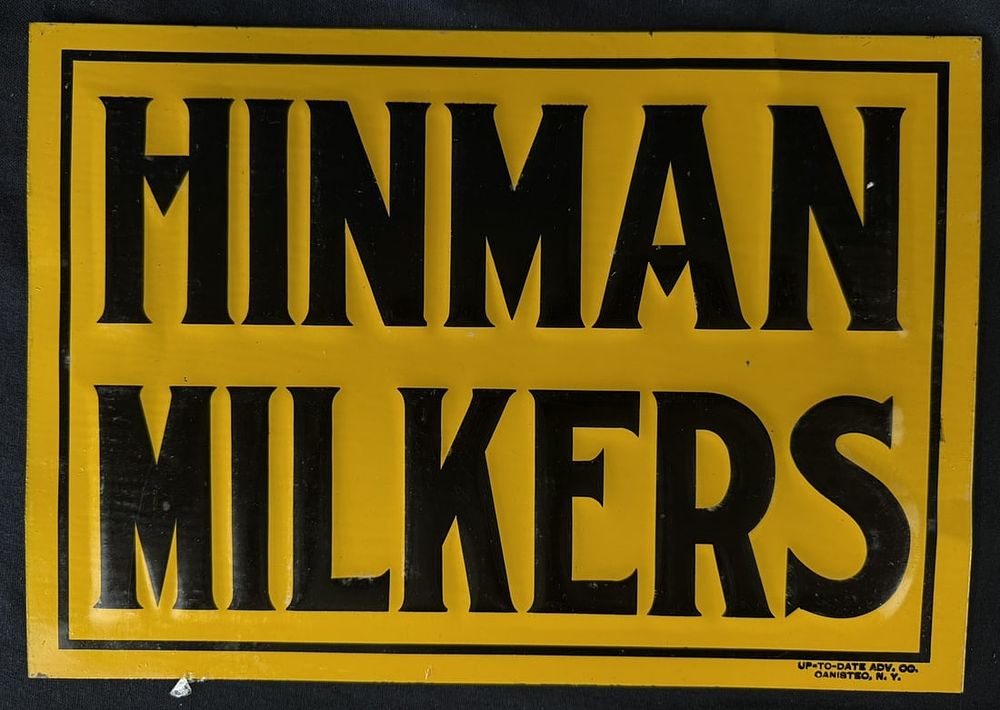 Lot 435: Hinman Milkers SST Tin Embossed Dairy Farm Advertising Sign
