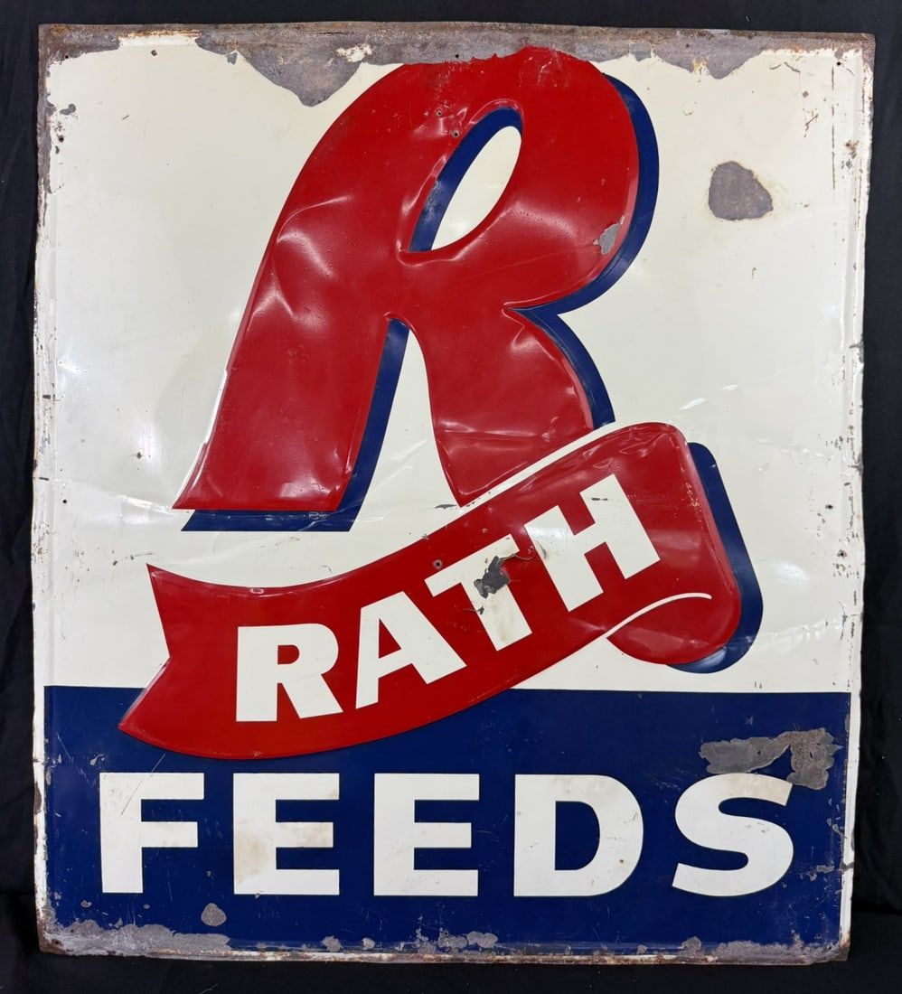 Lot 478: Rath Feeds Red White Blue Embossed Metal Farm Sign
