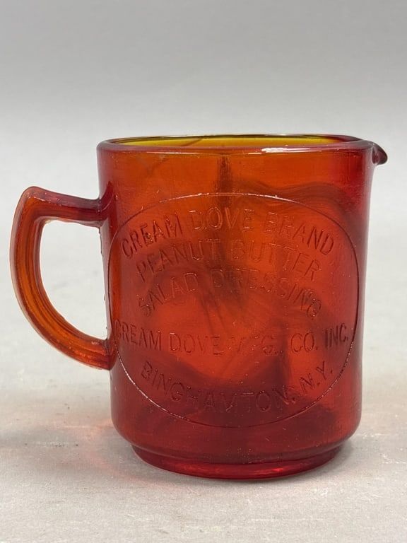 Lot 332: Cream Dove Brand Measuring Cup