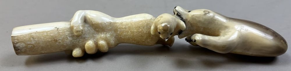 Lot 282: Bone Polar Bear Baby Seal Human Hand Carving