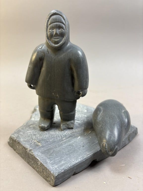 Lot 283: Inuit Soapstone Seal Hunter with Seal Carving