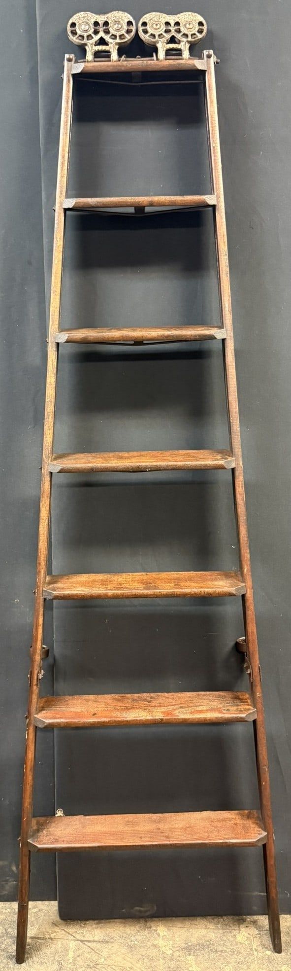 Lot 394: Original Antique 7 Stair Library Ladder w/ Queen Cast Hdw