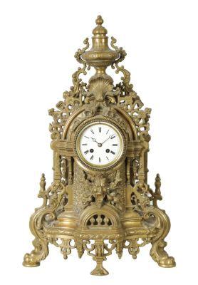 A LATE 19TH CENTURY FRENCH ORNATE AND PIERCED BRASS MANTEL CLOCK OF LARGE SIZE with shaped base 