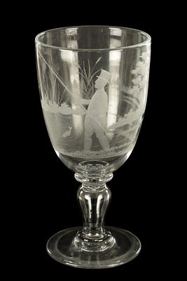 A LATE GEORGIAN GIANT GLASS GOBLET with finely engraved angling and landscape scene on a ringed 