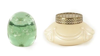 A VICTORIAN GREEN GLASS DUMP PAPERWEIGHT with flower head centre. TOGETHER WITH AN EARLY 20TH 