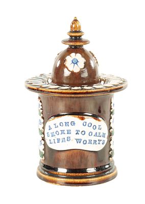 A 19TH CENTURY MEASHAM BARGEWARE TOBACCO JAR brown slip glazed with relief-decorated floral 