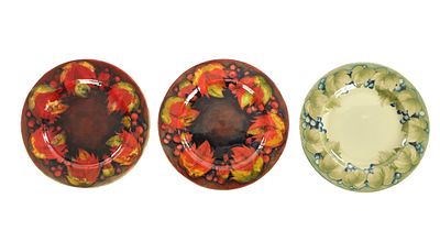 A PAIR OF 1930/40'S W MOORCROFT PLATES decorated in the leaf and berry pattern under a flambe 