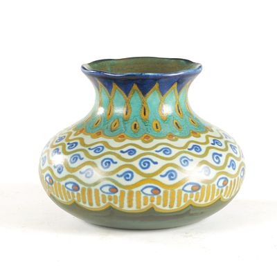 A LIBERTY &amp; CO. GOUDA DUTCH POTTERY ART VASE decorated in shades of blue, green and mustard 