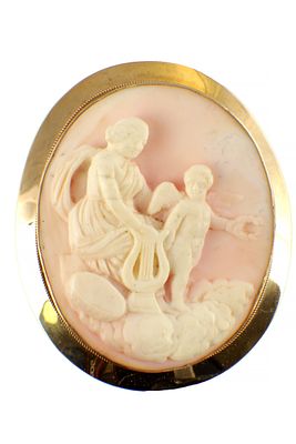 A VICTORIAN 9CT GOLD MOUNTED CORAL CAMEO BROOCH depicting mother and child with a lyre, set in 