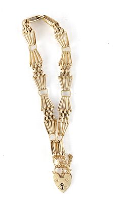 A 9CT GOLD STARBURST LINK BRACELET WITH LOCKET CLASP 10.9g