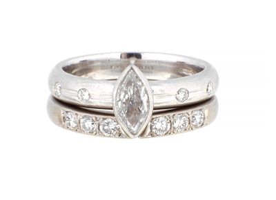 A PLATINUM DIAMOND BRIDAL SET ENGAGEMENT RING AND MATCHING WEDDING BAND having a marquise 