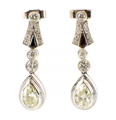 A PAIR OF PLATINUM AND DIAMOND PENDANT EARRINGS the pear-shaped diamonds bezel set in platinum 