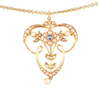 A 15CT YELLOW GOLD OPEN SCROLL PENDANT AND CHAIN the pendant forming a flowerhead with a 