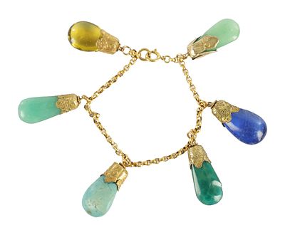 A LATE 19TH CENTURY GOLD METAL BRACELET WITH HARD STONE DROPS having jade stones mounted on a 