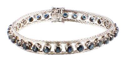 A LADIES 18CT WHITE GOLD SAPPHIRE BRACELET, having 30 rose cut sapphires on a textured 