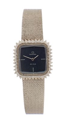A LADIES 18CT WHITE GOLD AND DIAMOND SET OMEGA DE VILLE WRIST WATCH, on the original textured 