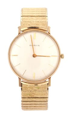 A GENTLEMAN'S VINTAGE 9CT GOLD MARVIN WRIST WATCH, on the gold-filled bracelet, the silvered
