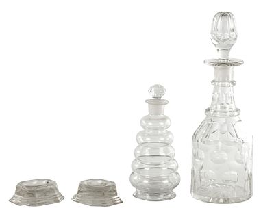 A COLLECTION OF 18TH/19TH CENTURY GLASSWARE comprising two decanters and a pair of salts. (31 