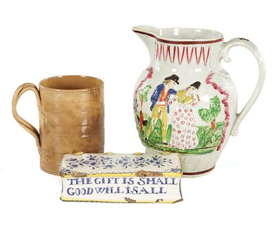 A COLLECTION OF EARLY ENGLISH POTTERY including a glazed cup, a creamware jug and a glazed 