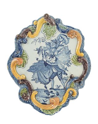 AN 18TH CENTURY DUTCH DELFT HANGING WALL PLAQUE with polychrome decoration depicting lovers in 
