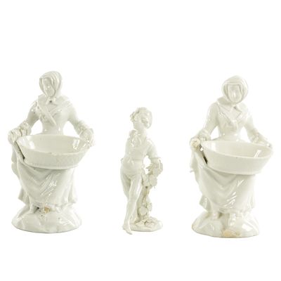 A PAIR OF 19TH CENTURY MEISSEN FIGURES modelled as two females carrying baskets - stamped to 