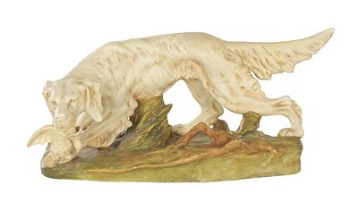 A 20TH CENTURY ROYAL DUX FIGURE OF AN ENGLISH SETTER on a naturalistic base, the dog is 