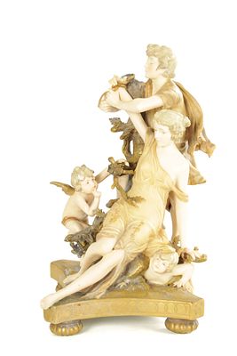 A LATE 19TH/20TH CENTURY ERNST WAHLISS PORCELAIN FIGURE GROUP modelled as Amynthas freeing 