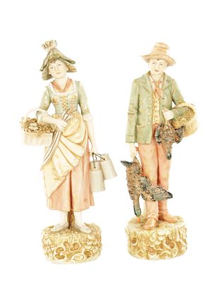 A PAIR OF 20TH CENTURY ROYAL DUX PORCELAIN FIGURES modelled as a young male and female, the 