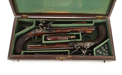 WOGDON, LONDON. A FINE CASED PAIR OF EARLY 19TH CENTURY FLINTLOCK DUELLING PISTOLS the 