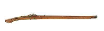 A 19TH CENTURY JAPANESE MATCHLOCK MUSKET having a full oak stock with brass mounts and a steel 